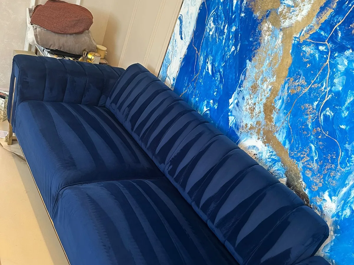 Blue velvet sofa deep cleaned with professional upholstery equipment